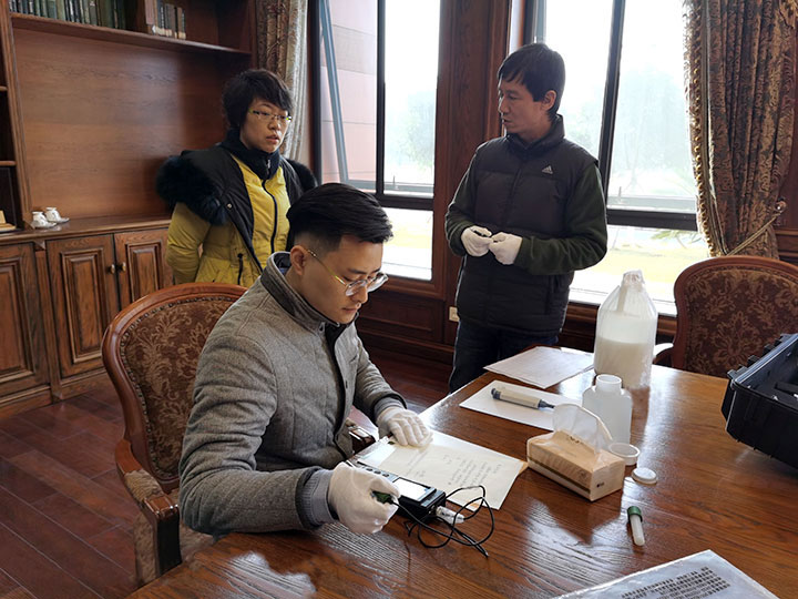 Our stuff conducting pH test on precious manuscrip